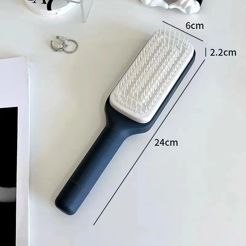 Roland purple and lunar rock grey self-cleaning hair brush with anti-static massage comb teeth.