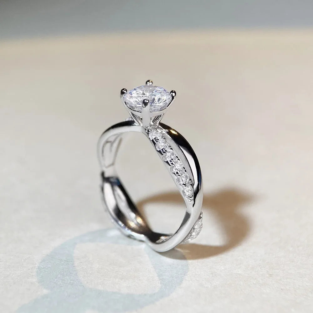 Silver geometric cross ring with 1 karat moissanite stone and twisted band