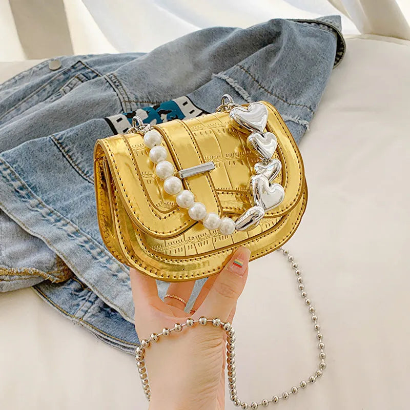 Horizontal square mini saddle bag in PU leather with sandwich pocket detail and adjustable shoulder strap