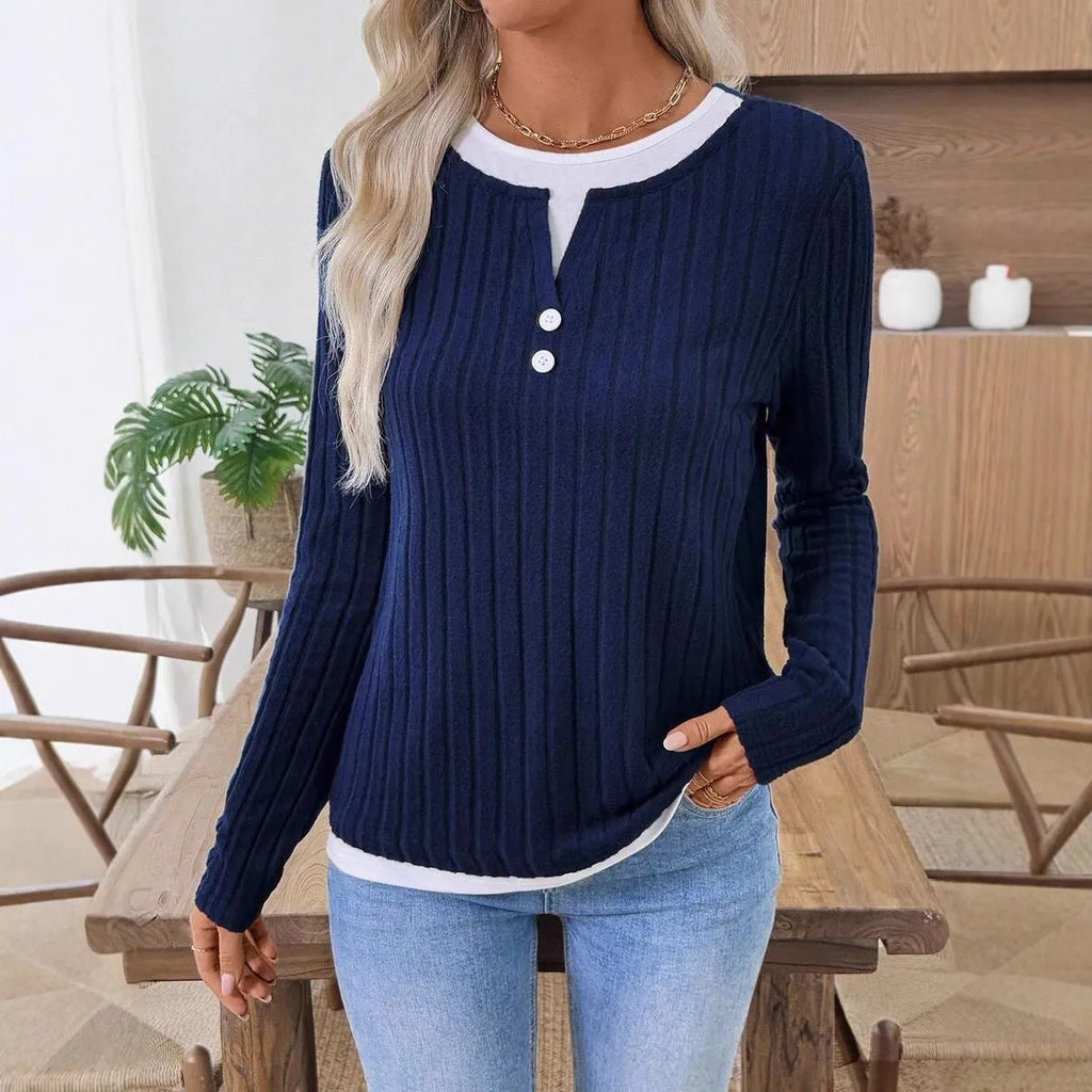 Women's black fake two-piece pullover sweater with round neck and long sleeves.