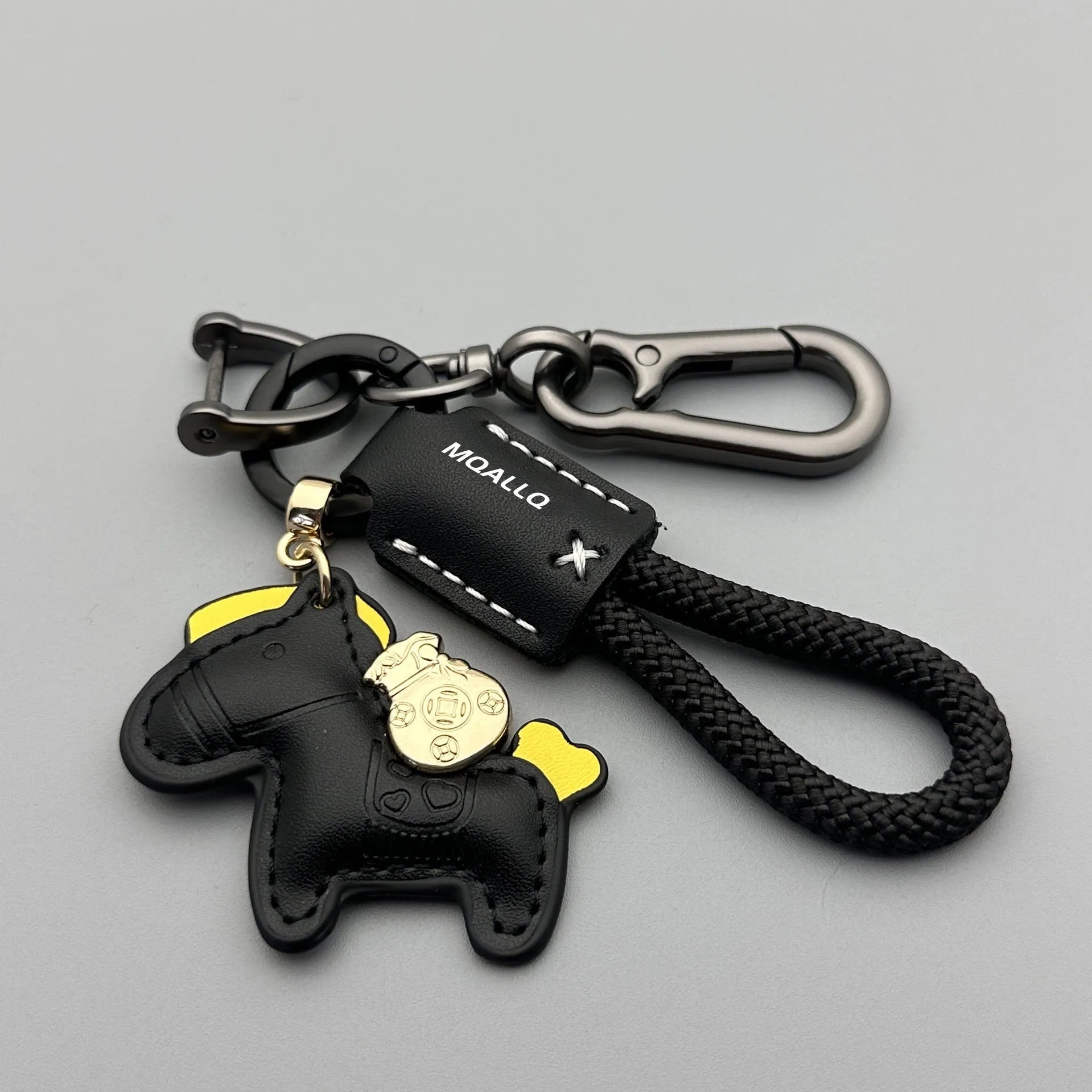 Handmade brown cowhide car key pendant with green flanelle rope and a metal buckle.