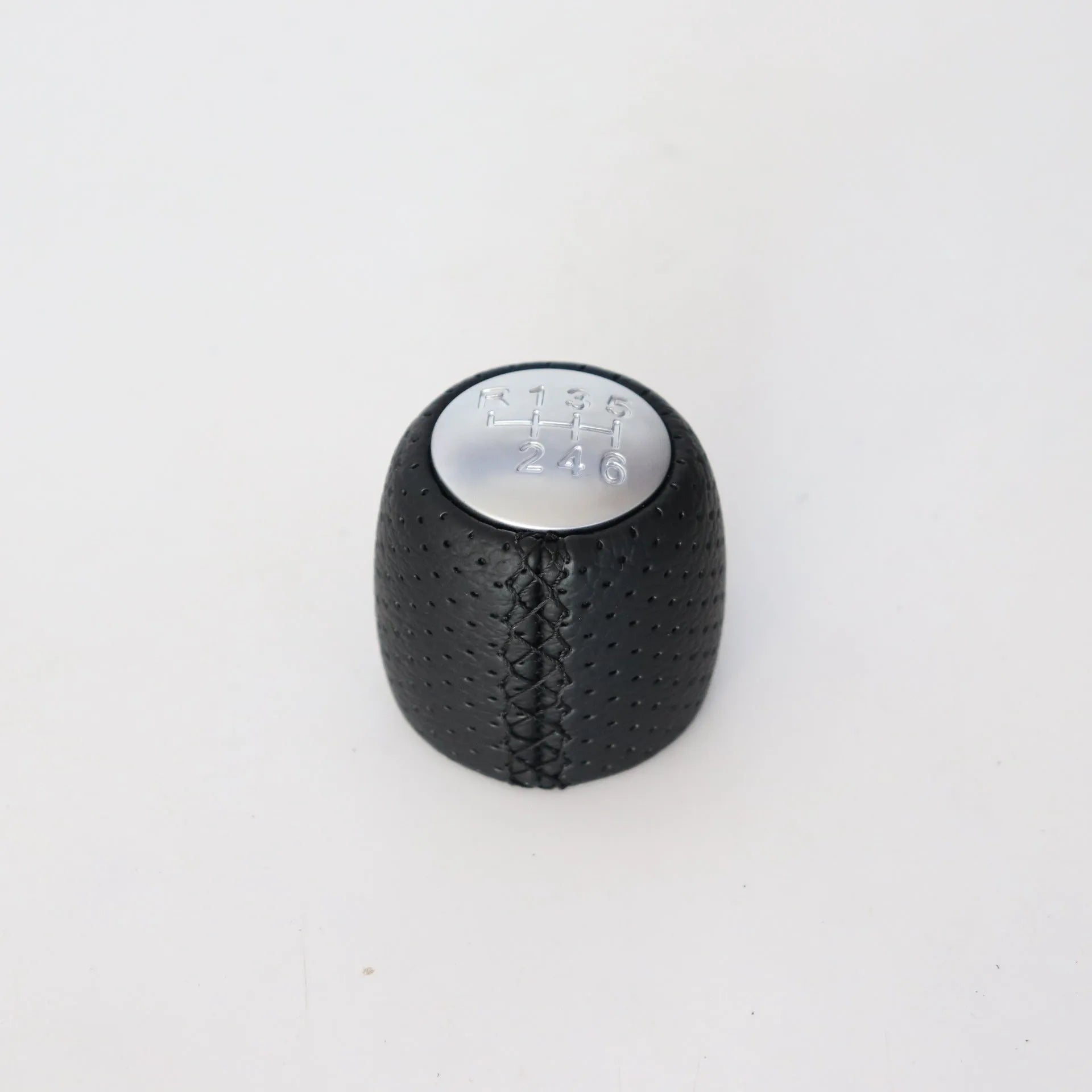 Black leather handball gear with perforations for Alpha car, shown with silver and matte cover options.