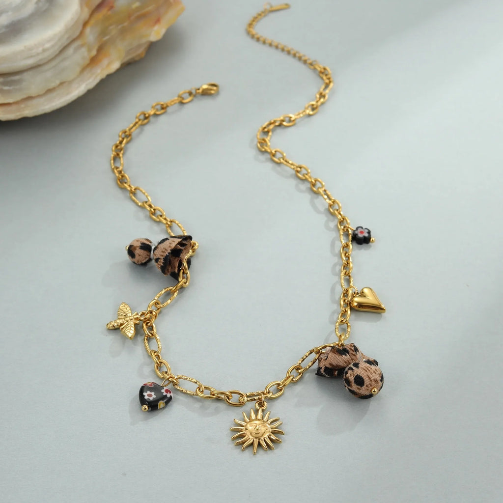 Leopard, love heart, and flowers design on a geometric stainless steel pendant necklace with an adjustable chain.