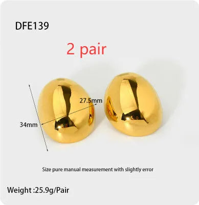 Close-up of simple geometric stainless steel stud earrings with 18K gold plated glazed finish and line design.