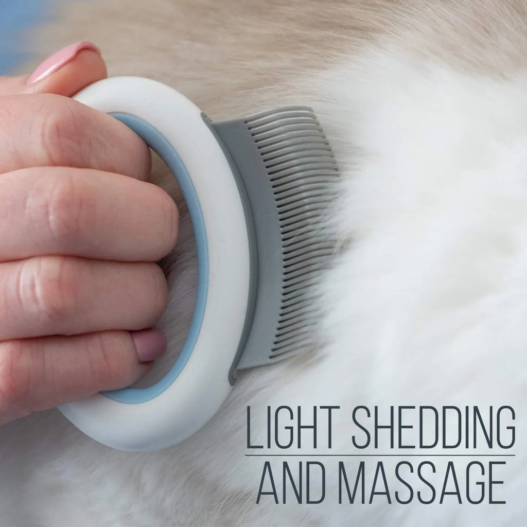Blue pet grooming brush with soft teeth and ergonomic handle for deshedding cats and dogs.