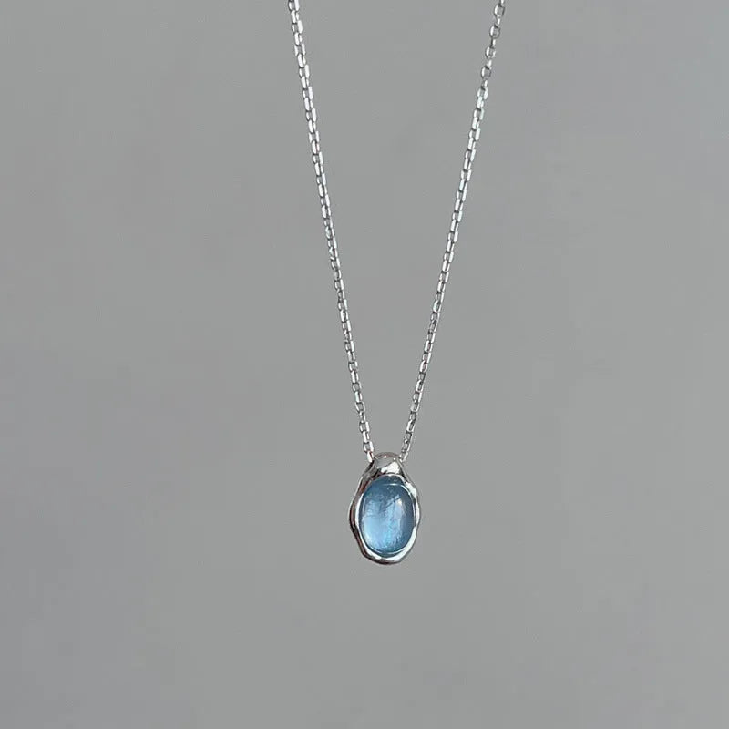 Women's navy blue water drop necklace with geometric pendant on adjustable copper chain