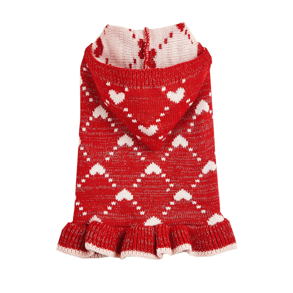 Small dog wearing blue knit sweater hoodie dress with heart motif on front