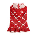 Small dog wearing blue knit sweater hoodie dress with heart motif on front