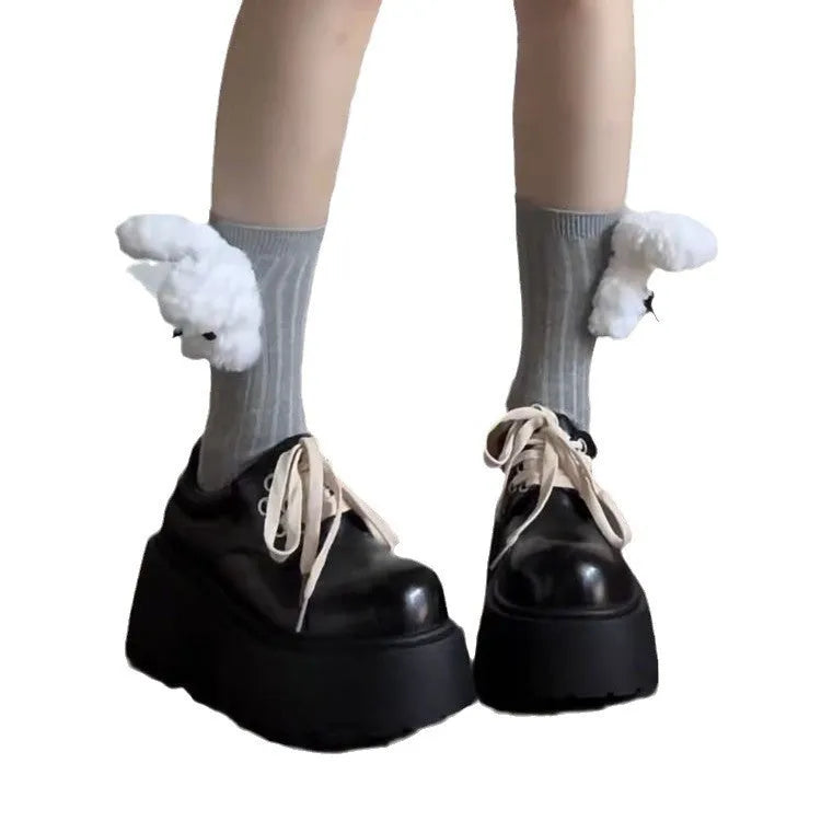 Matte black women's high-heel shoes with a thick rubber sole and lace-up buckle.