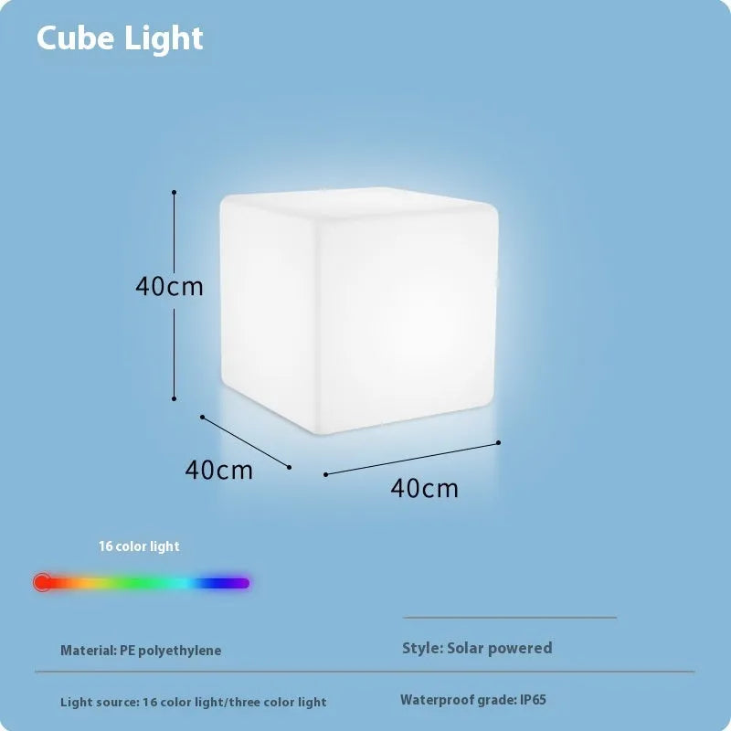 White square LED cube stool light for outdoor use, showing modern design with solar panel or charging port.