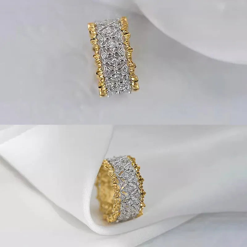 Geometric gold two-tone zircon ring on a copper band, showing round detail.