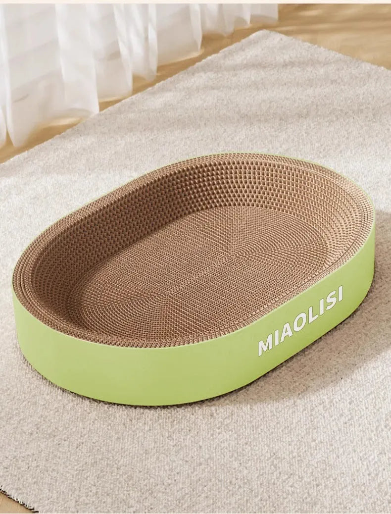 Green oval cat scratch board and nest measuring 55cm in diameter made from corrugated paper