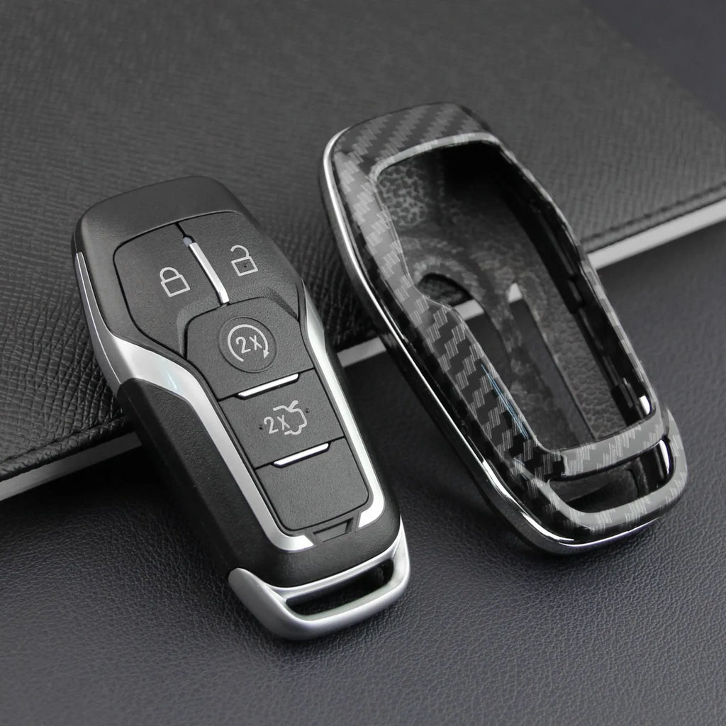 Plastic protective shell for a car key remote, shown in two colour variations