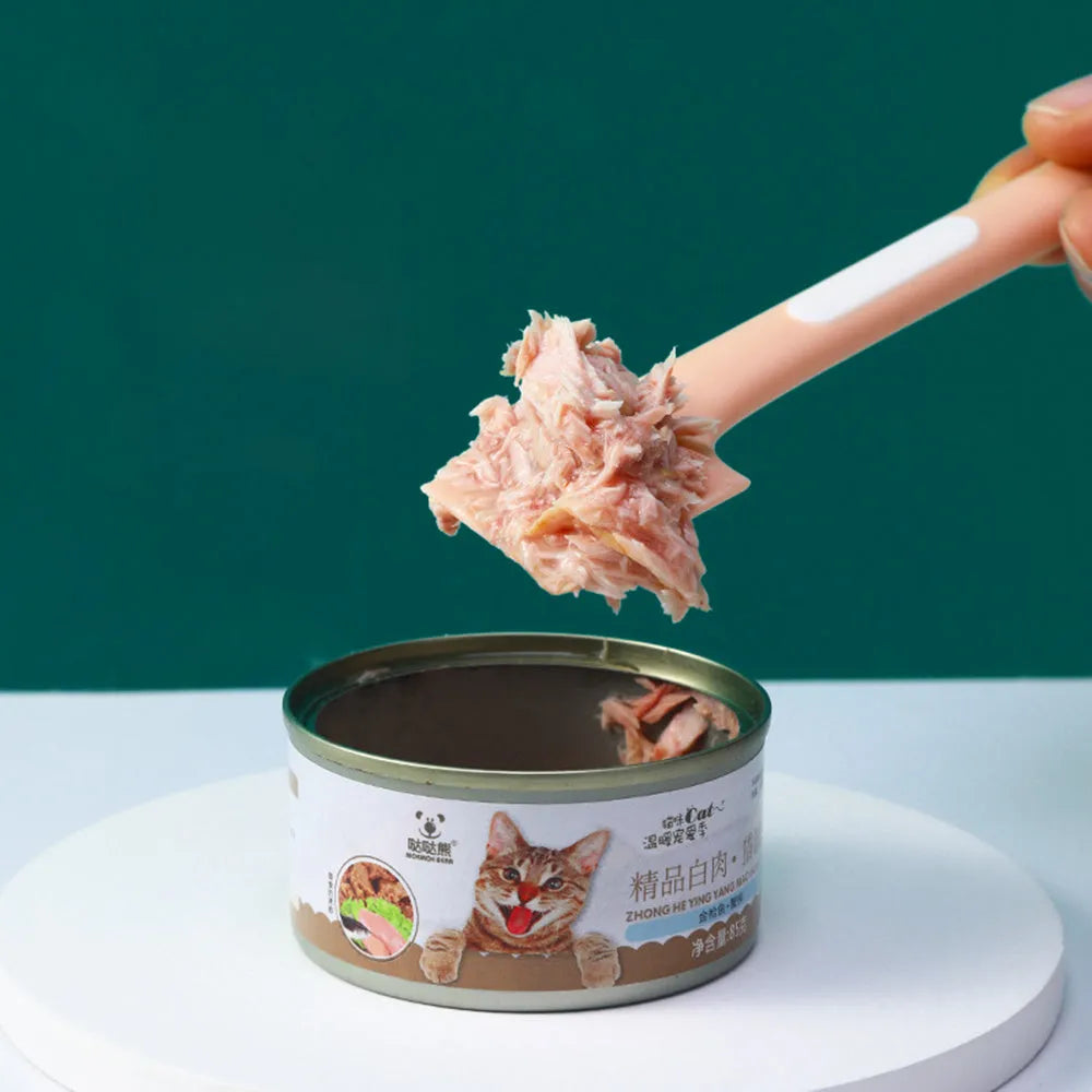 Long-handled pet feeding spoon in green colour with right-angle design for canned food