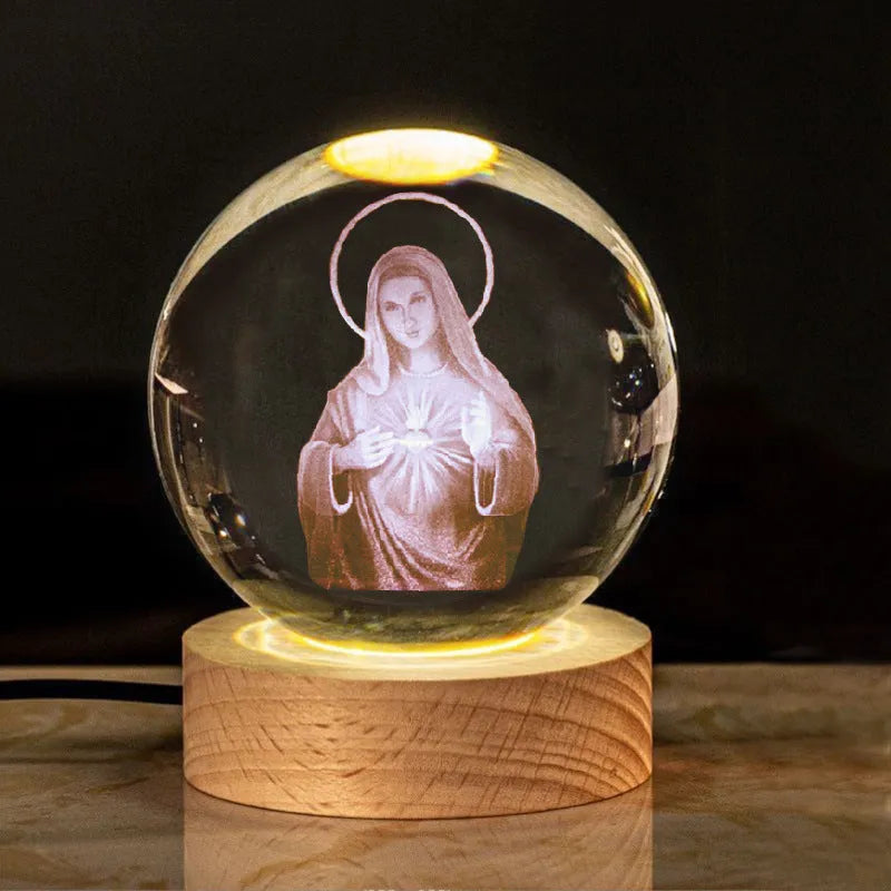 White crystal ball with cross and religious symbols on wooden LED base desk ornament