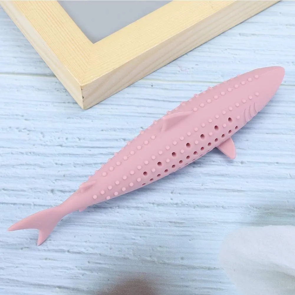 Green silicone fish shaped cat chew toy with breathable side holes on a white background