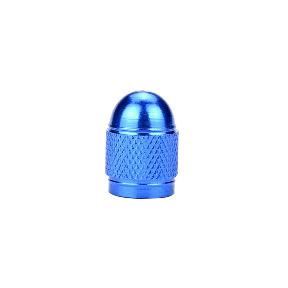 Aluminium alloy mountain bike tyre valve cap in multiple colour choices on a bicycle wheel.