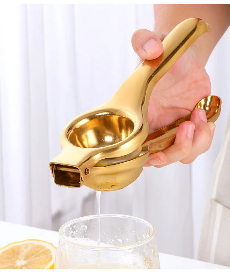 Manual stainless steel juicer Chinese style with metal body and round feed opening in gold finish