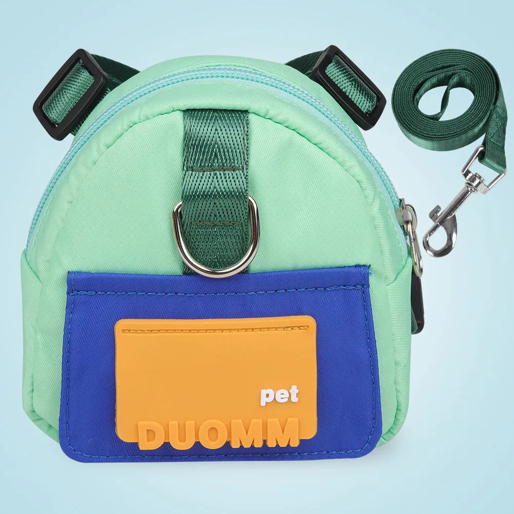 Blue adjustable dog backpack harness with storage compartments and a tow rope, shown on a medium-sized dog.