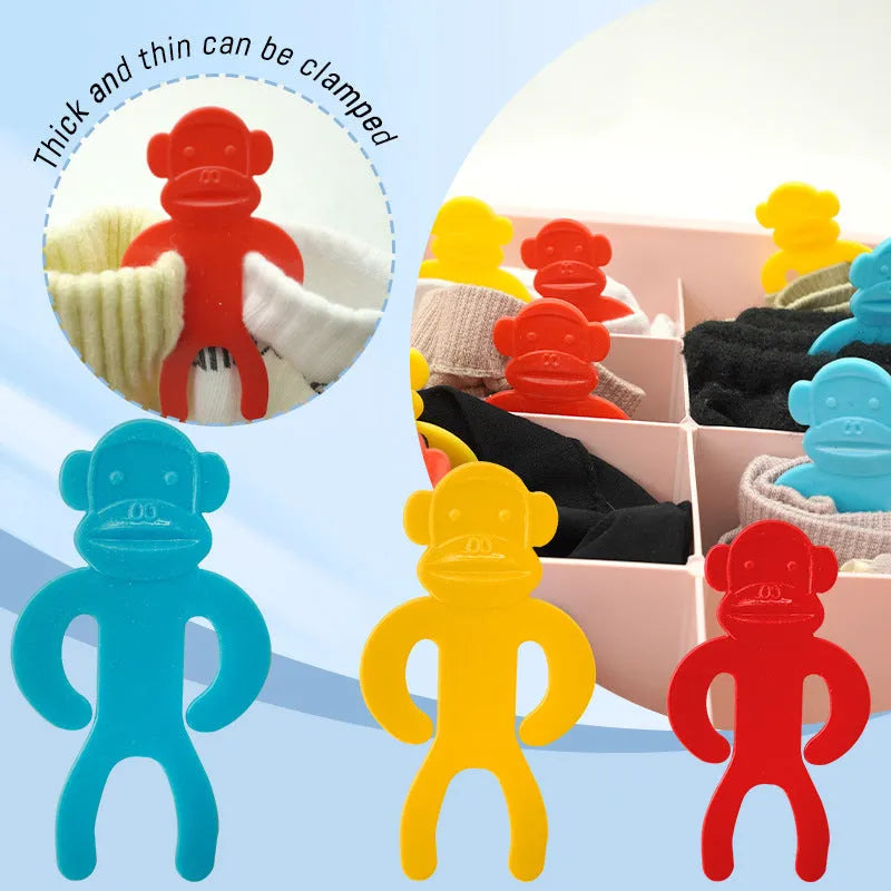Plastic sock clips for washing machines in blue, red, and yellow colours