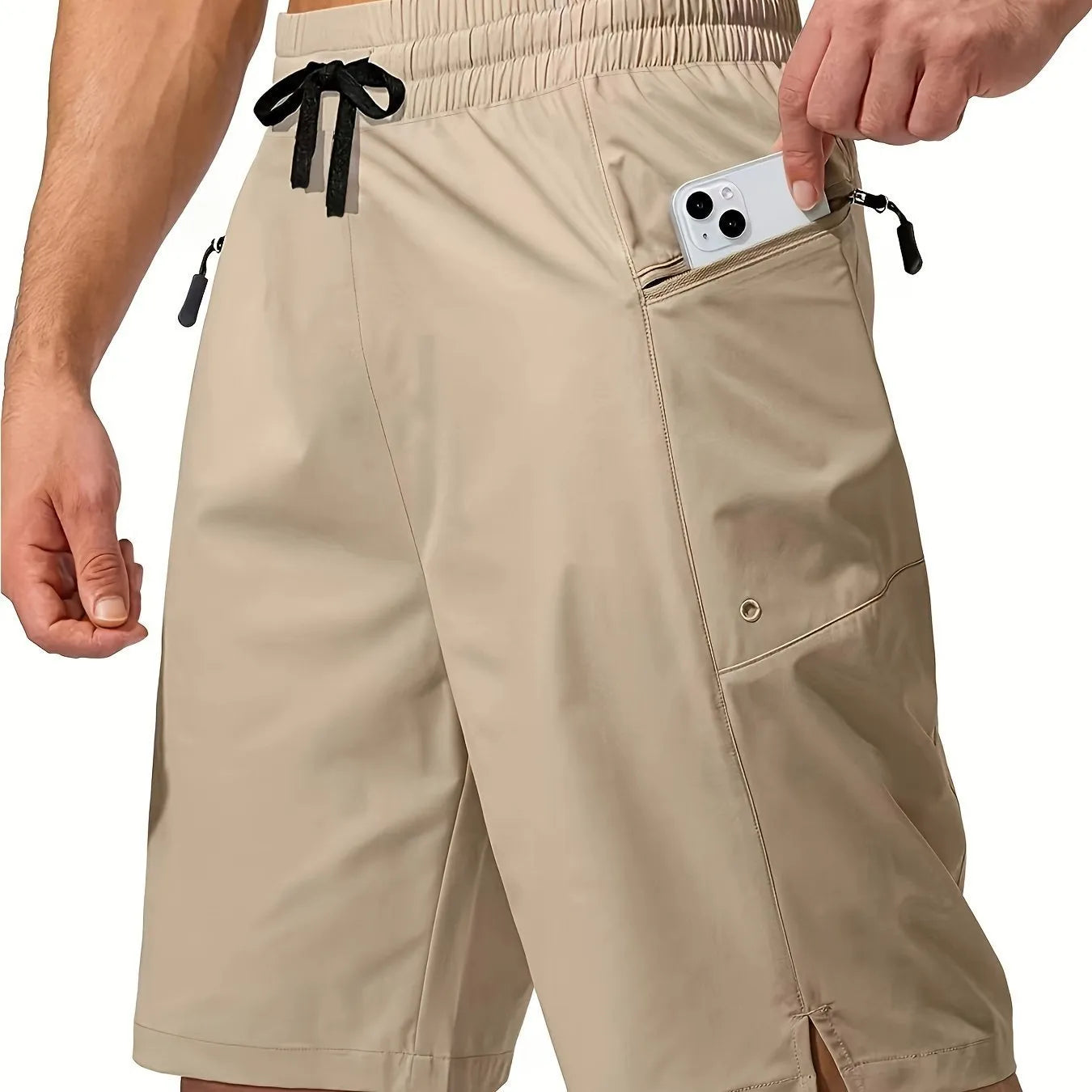 Man wearing solid colour quick-drying polyester beach shorts in a straight leg fit.