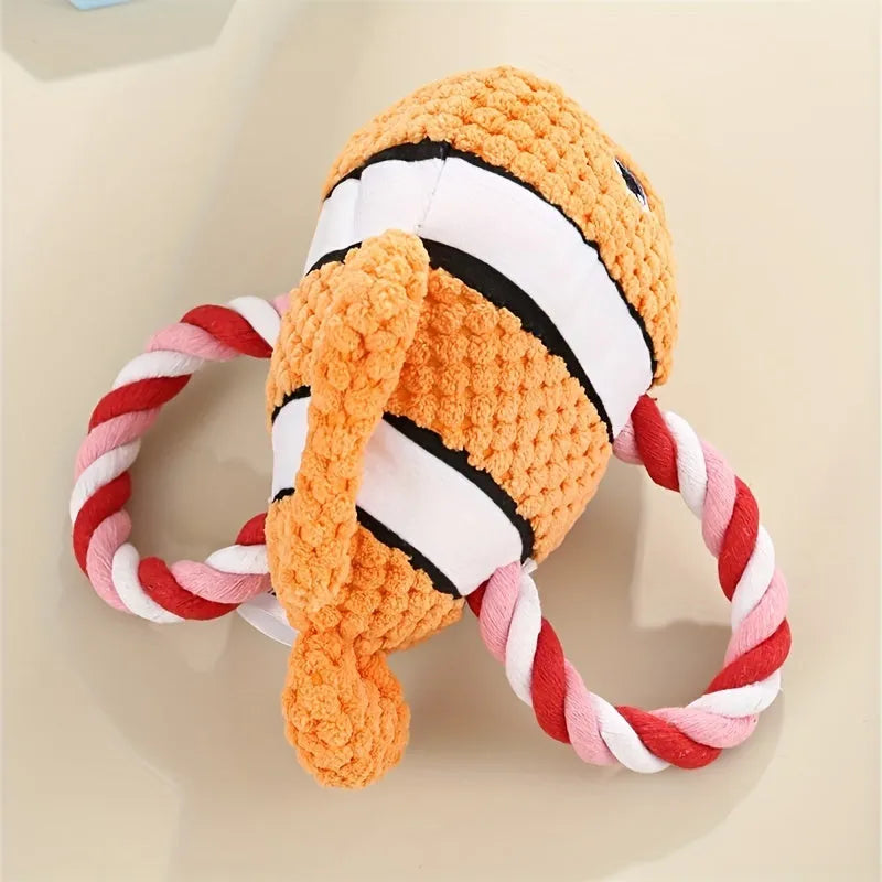 Turtle shaped dog chewing toy in gray green or orange plush fabric with knotted limbs for interactive pet play