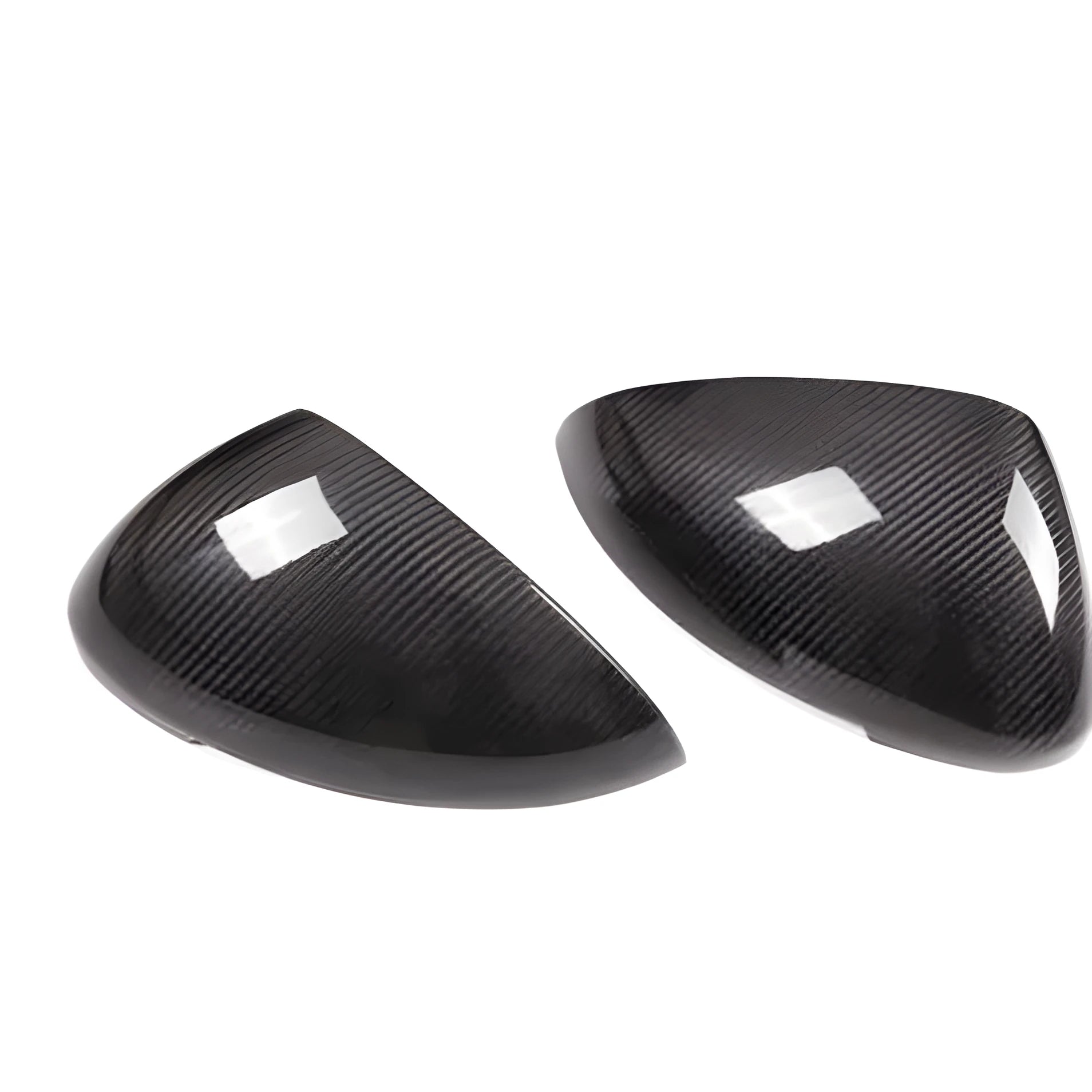 Glossy black true carbon fibre rearview mirror cover for Porsche Macan on a white background