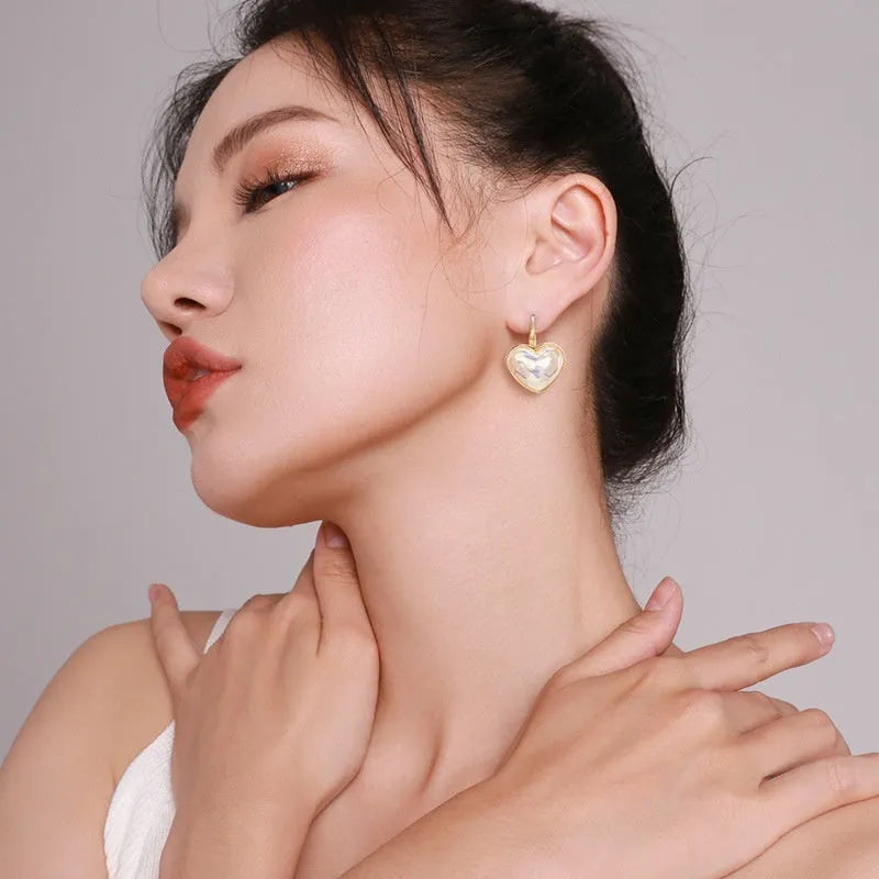 Gold-coloured clip-on earrings with natural style design for women