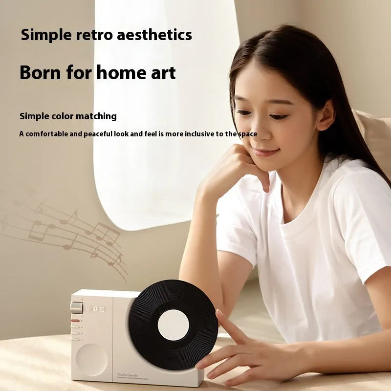 Mini portable Bluetooth speaker in Obsidian Black, Ivory White, Coral Pink, or Plum Green with USB charging port