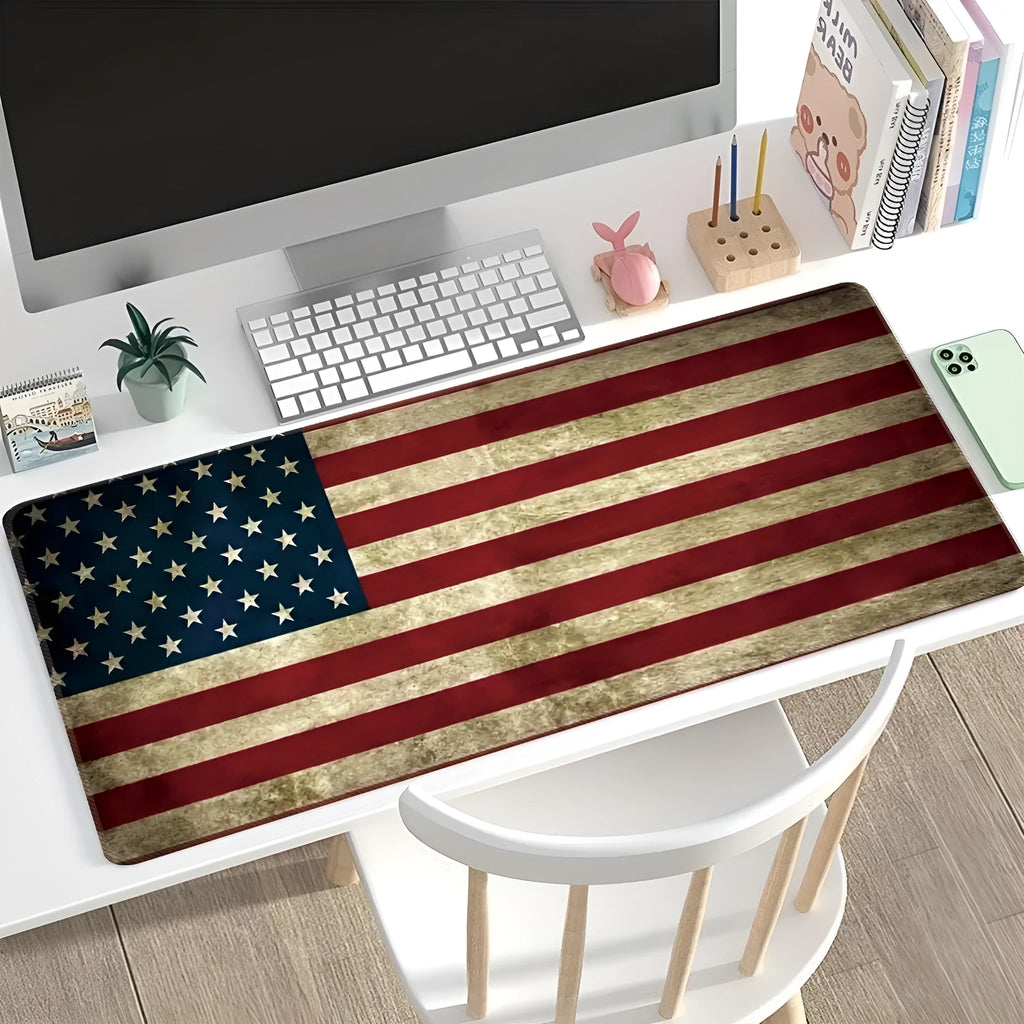 Large natural rubber desk mouse pad with a printed geometric pattern, showing non-slip base.