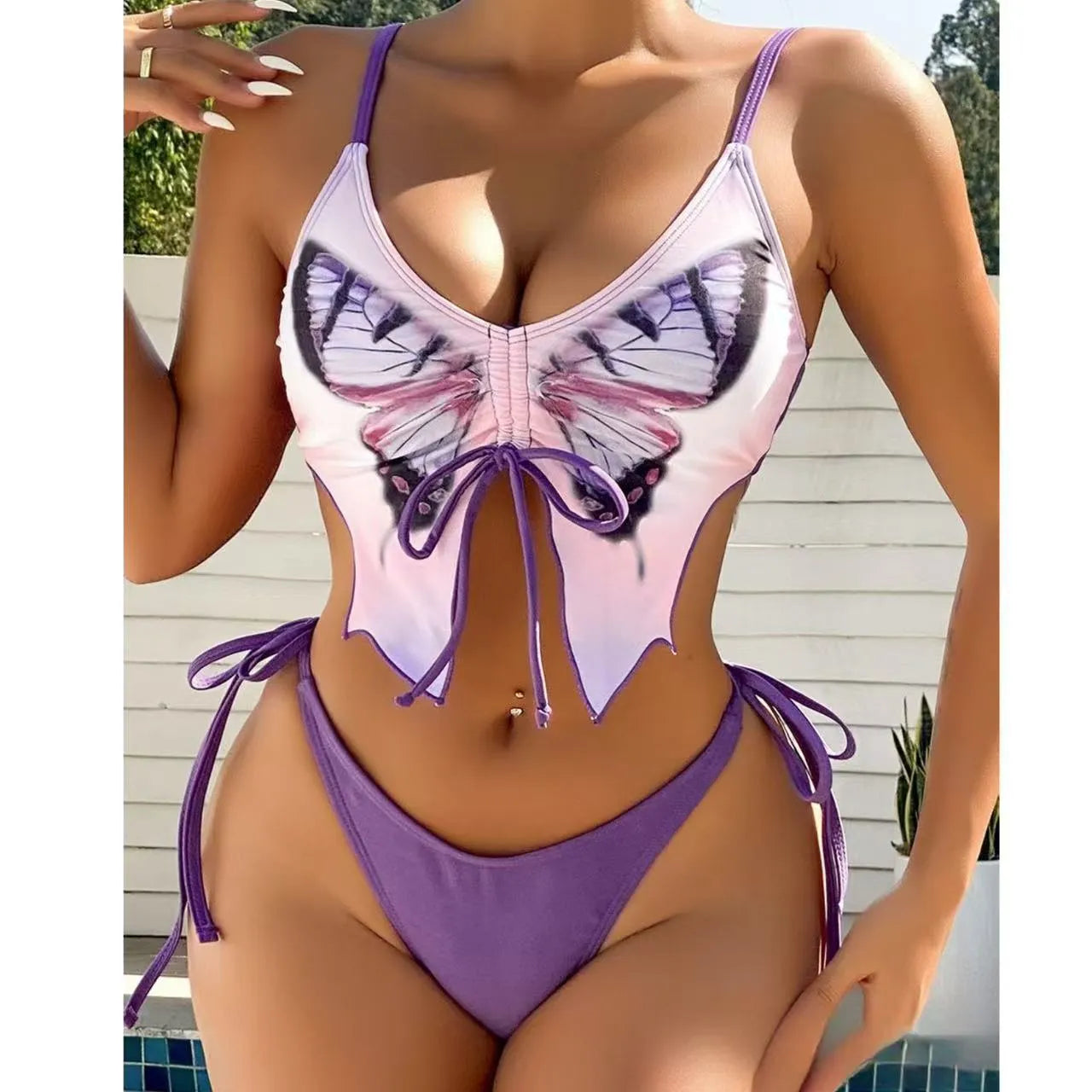 Women's purple bikini with bow ins style back detailing and briefs bottoms