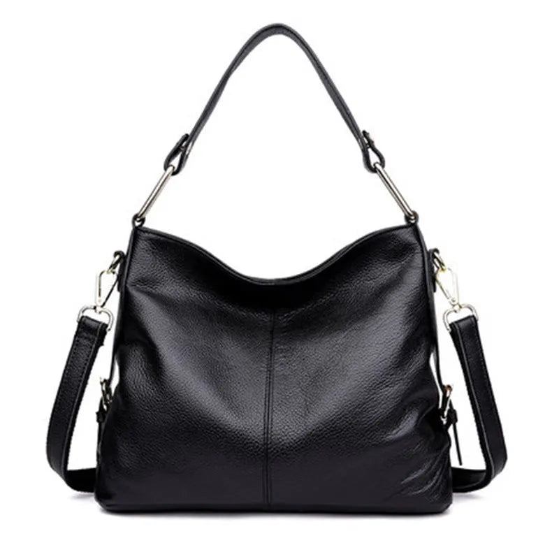 Genuine leather vertical square crossbody bag showing internal zipper compartments and external sandwich pocket