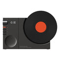 Mini portable Bluetooth speaker in Obsidian Black, Ivory White, Coral Pink, or Plum Green with USB charging port