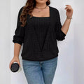 Woman wearing a solid colour rib fabric V-neck false two-piece suit with long sleeves in a loose fit.