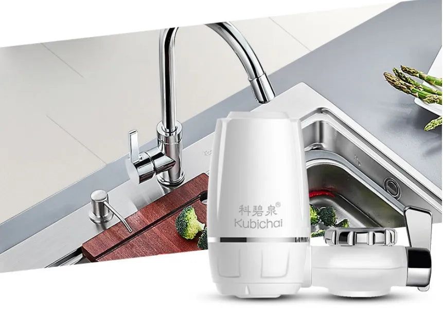 White plastic kitchen tap water filter with ceramic cartridge and installation adapters