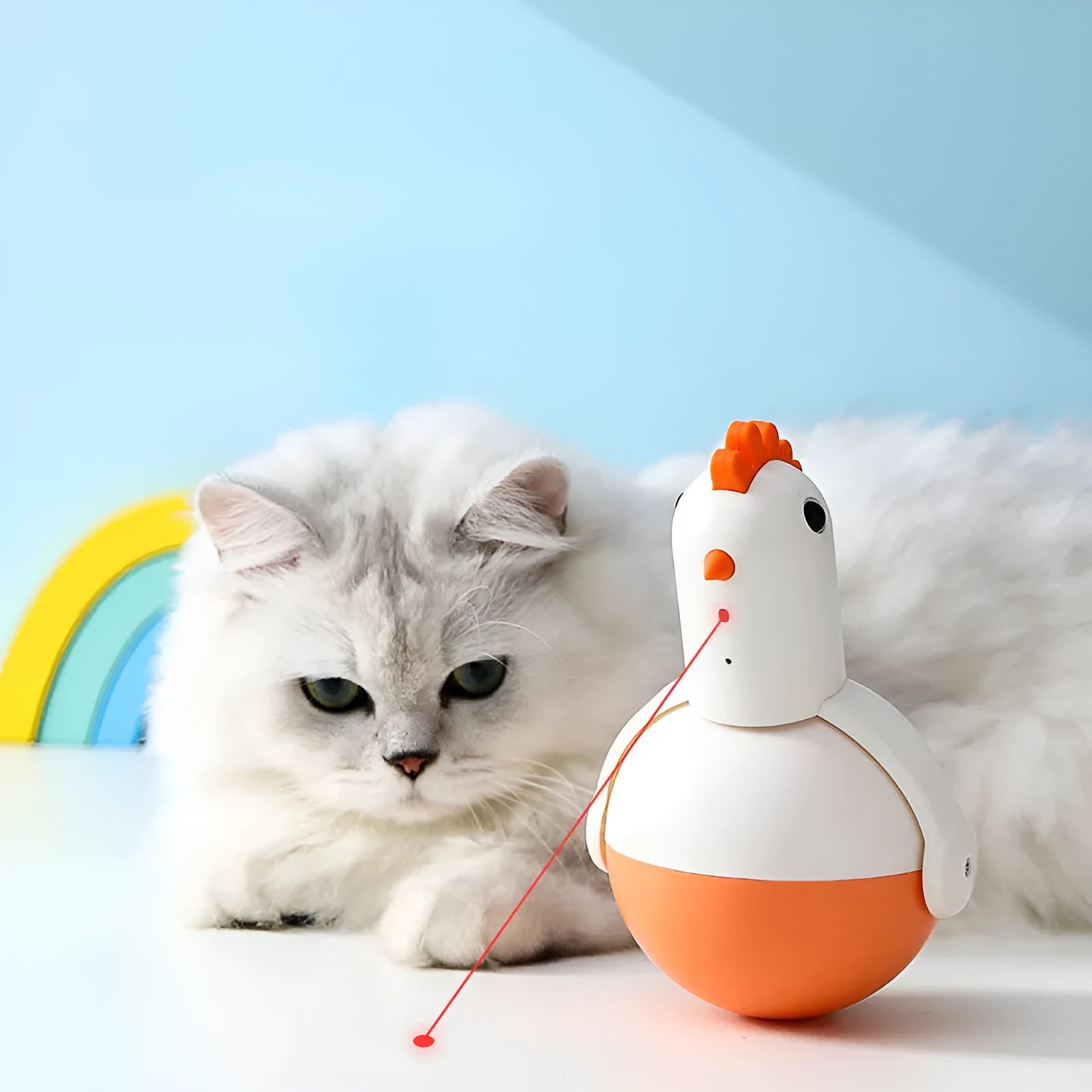 Green or orange electric chicken-shaped cat toy with laser and sound features on a flat surface.