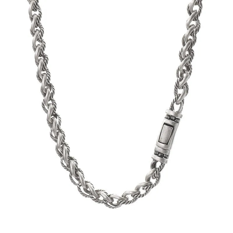Men's antique silver titanium steel keel chain necklace with large hemp flower links on a grey background.