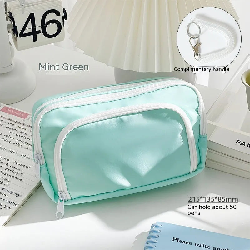 Double layer pencil case with carry handle in blue, cream, green, and pink colour options