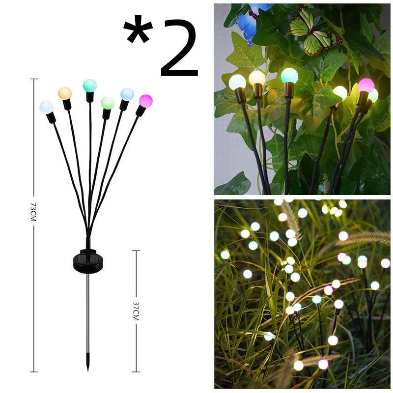 Solar-powered LED ground spike garden light with multiple heads and stainless steel soil plug.
