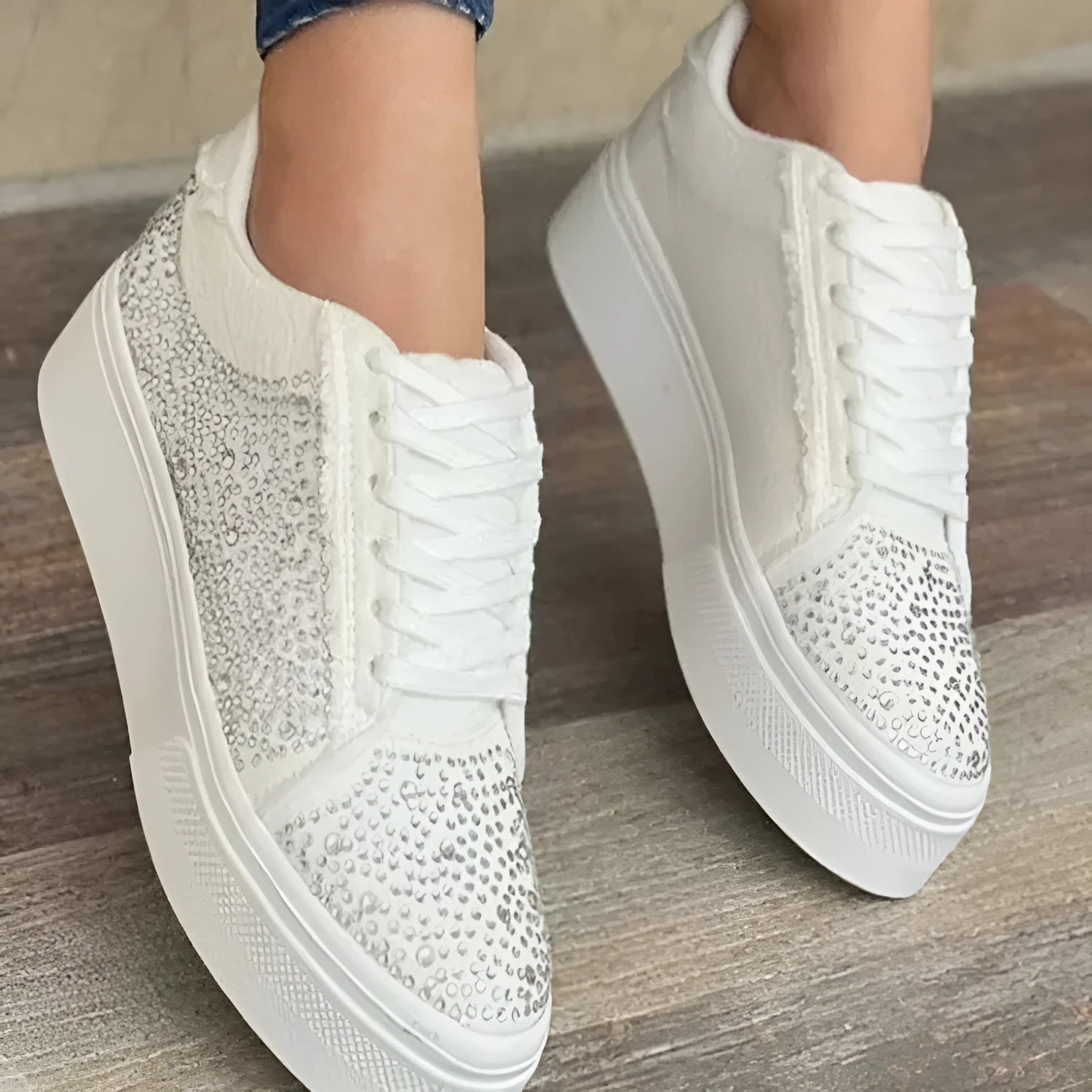 Women's black casual flat shoes with thick rubber sole, lace-up front, and rhinestone decoration.