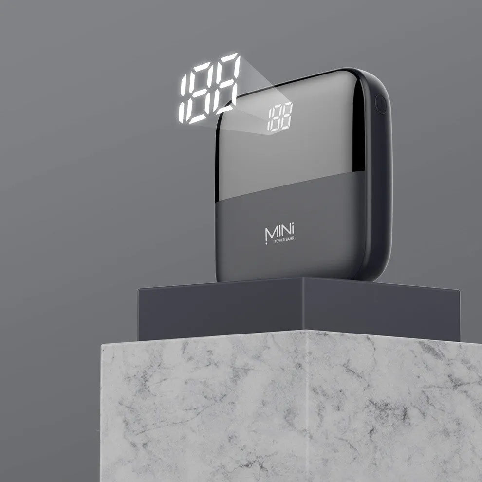 Portable 10000mAh power bank with digital display and dual USB outputs