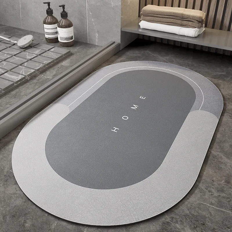 Blue oval blended fabric bathroom floor mat on a tiled floor