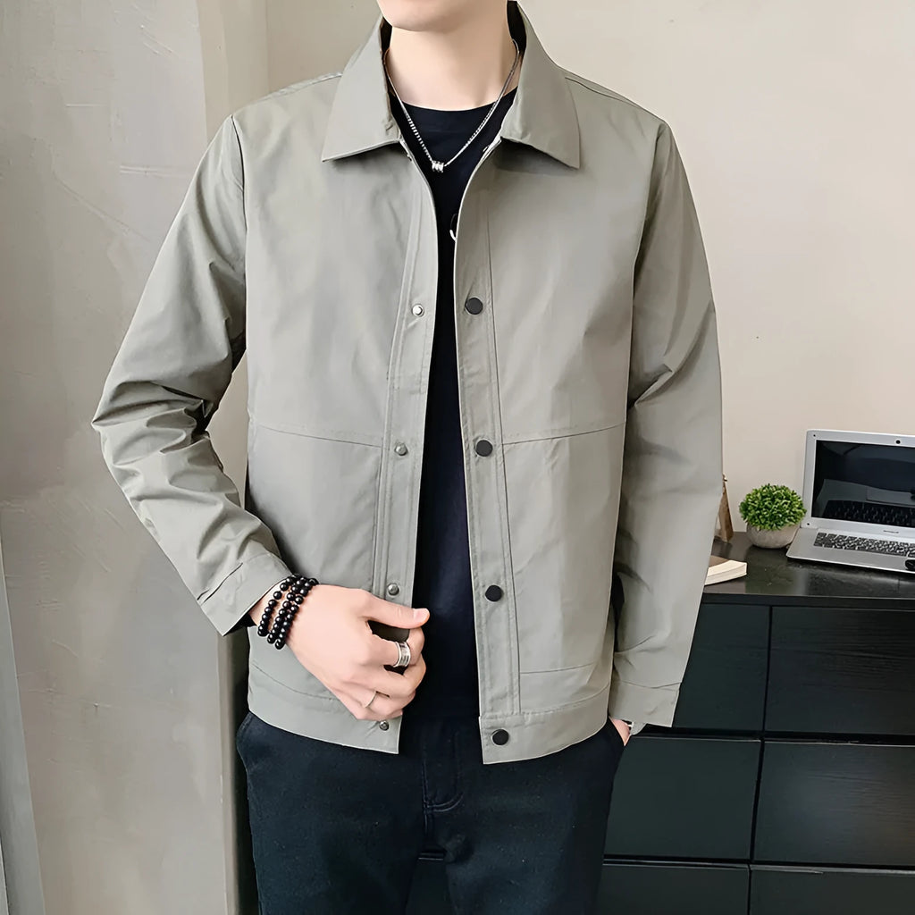 Man wearing a Korean style thin single-layer polyester jacket in light gray.