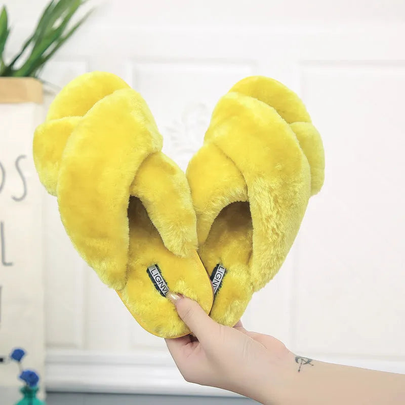 Women's cross open-toe fur slippers in black showing non-slip sole pattern
