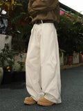 Men's pleated straight leg trousers in apricot colour with stripe pattern and loose fit design