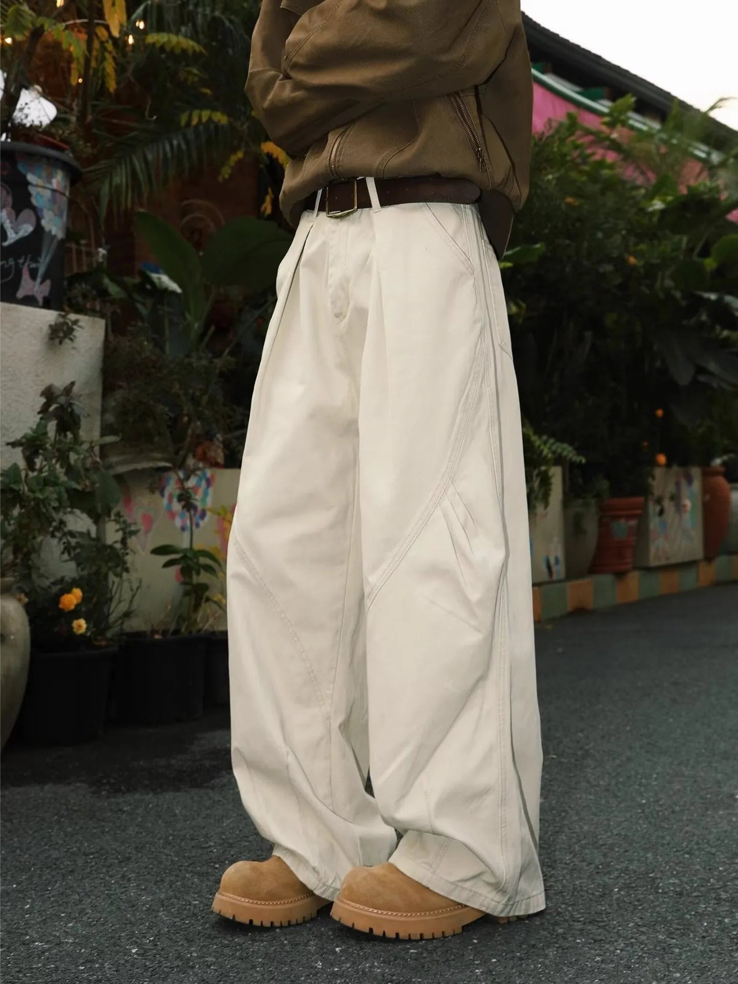 Men's pleated straight leg trousers in apricot colour with stripe pattern and loose fit design