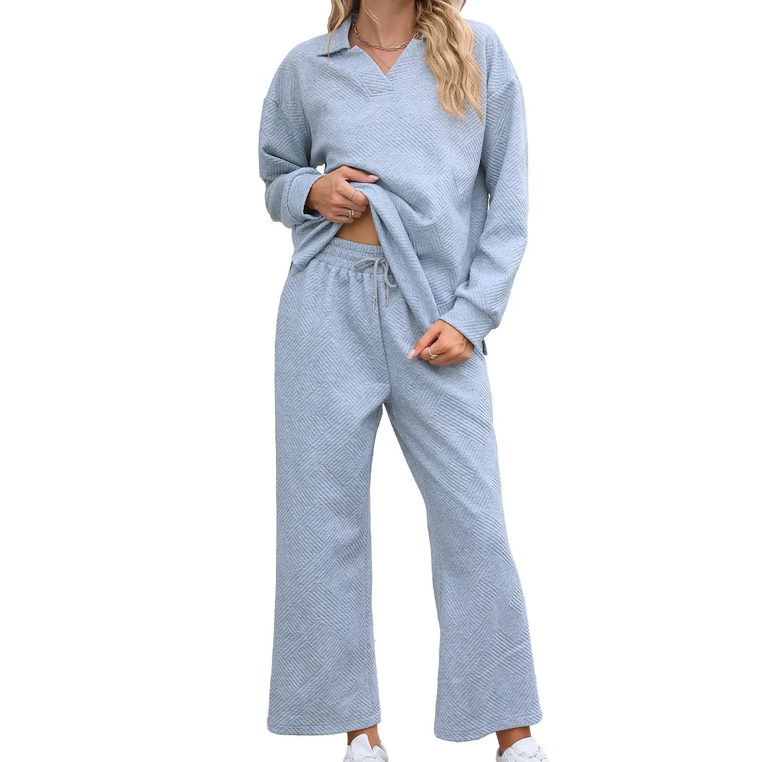 Women's knitted jacquard two-piece suit with geometric pattern detail in solid colour with long sleeves and elastic waist trousers