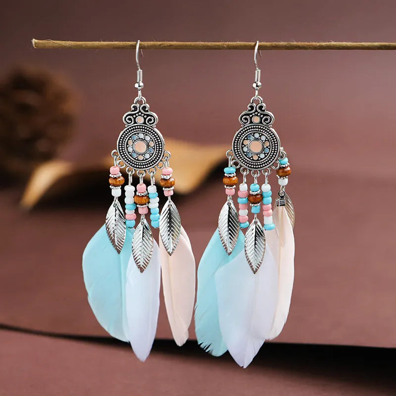 Round drop feather earrings with leaf detailing in various bohemian colours