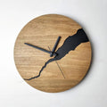 Modern wooden wall clock with creative crack pattern design on white wall