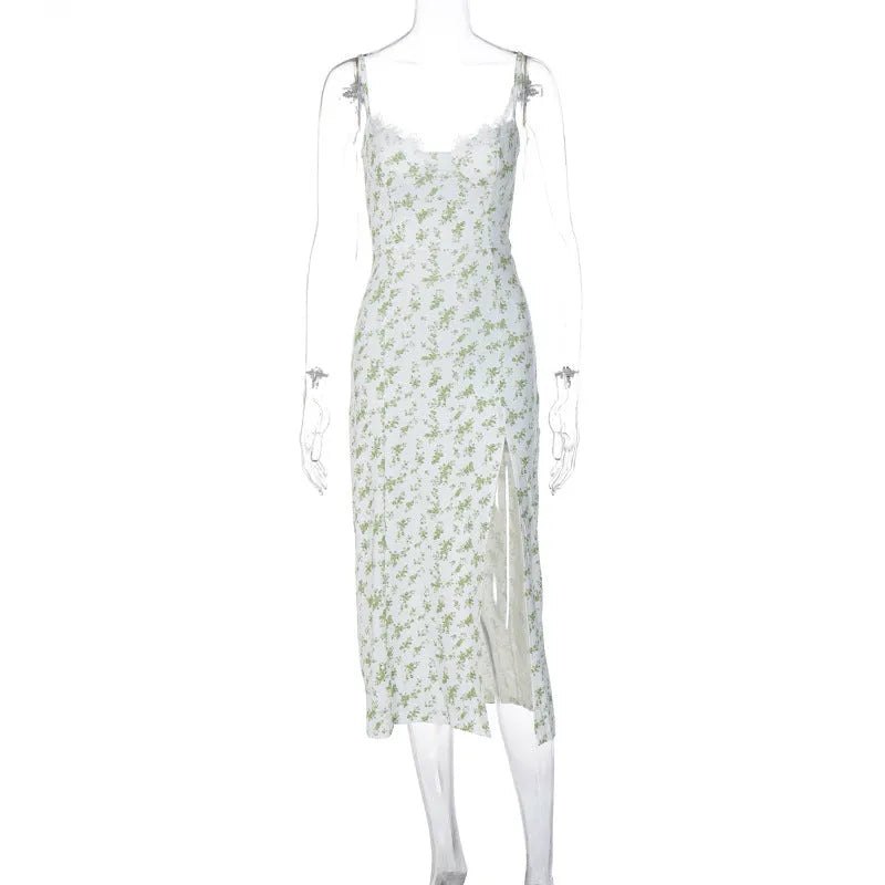 Women's blue long dress with white lace flower print, side slit, and thin adjustable suspender straps.